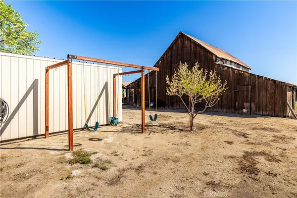 a backyard of a house with shaded area