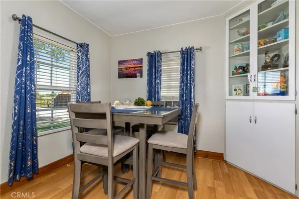 a view of a dining room with furniture and window