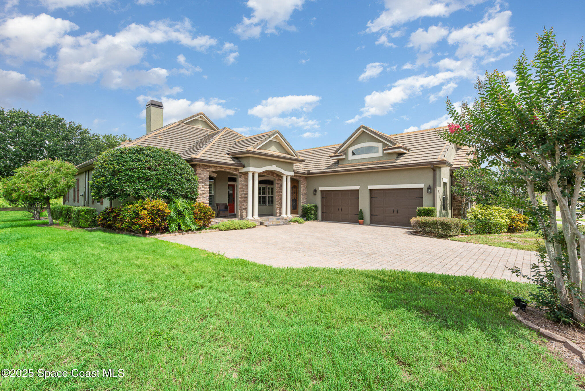 3260 Quantum Place Mims, FL 32754 - Photo 1 of 43 a front view of a house with a garden and yard
