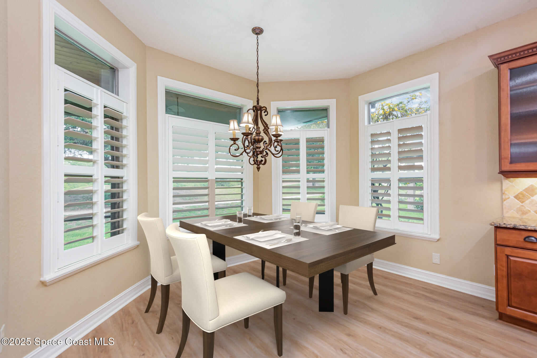3260 Quantum Place Mims, FL 32754 - Photo 11 of 43 a view of a dining room with furniture window and wooden floor