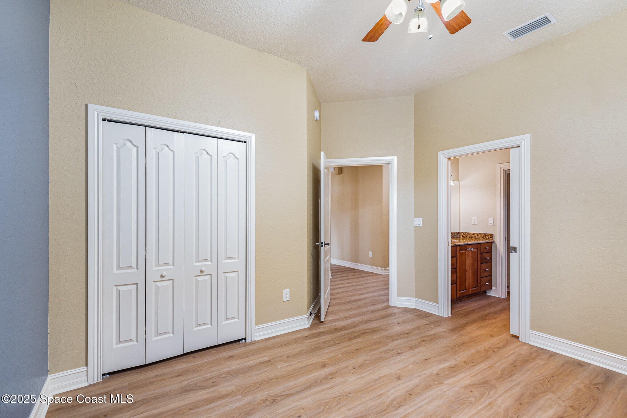 3260 Quantum Place Mims, FL 32754 - Photo 27 of 43 an empty room with wooden floor and closet