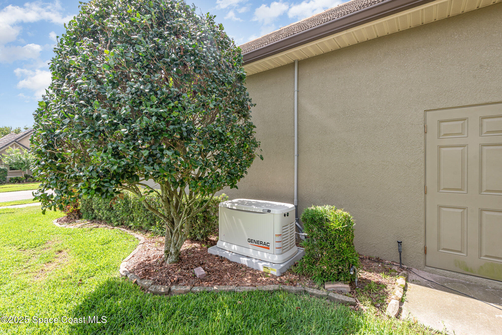 3260 Quantum Place Mims, FL 32754 - Photo 32 of 43 a view of a backyard with plants and a fountain