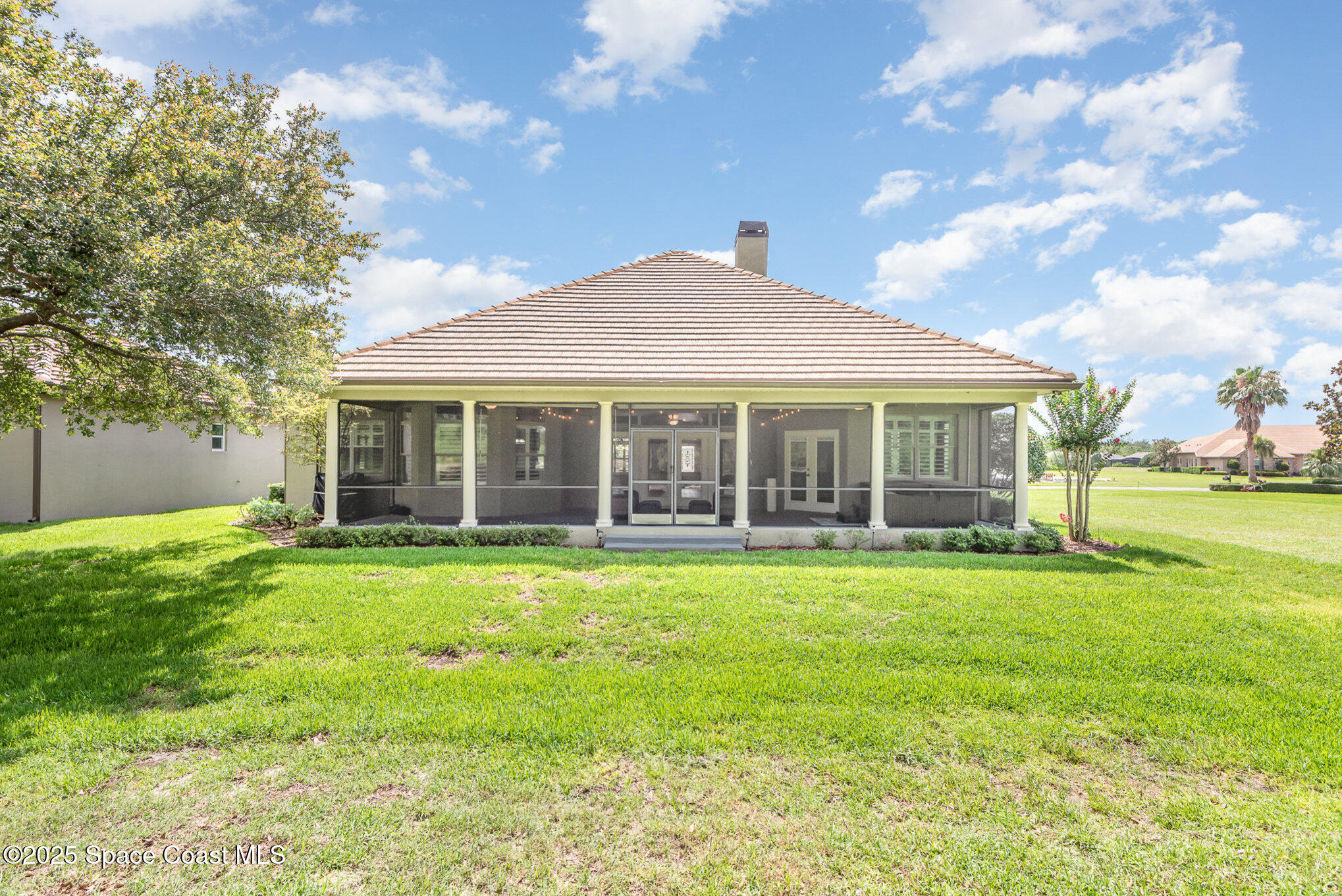 3260 Quantum Place Mims, FL 32754 - Photo 35 of 43 a front view of a house with a garden