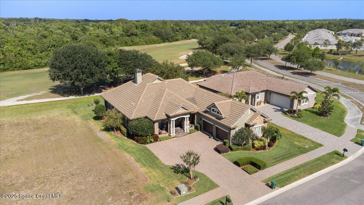 3260 Quantum Place Mims, FL 32754 - Photo 37 of 43 an aerial view of a house with a garden