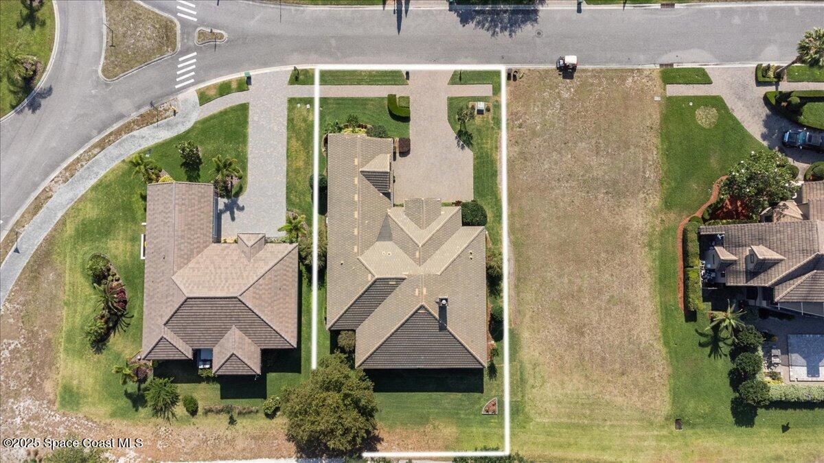 3260 Quantum Place Mims, FL 32754 - Photo 38 of 43 an aerial view of a house with a yard and potted plants