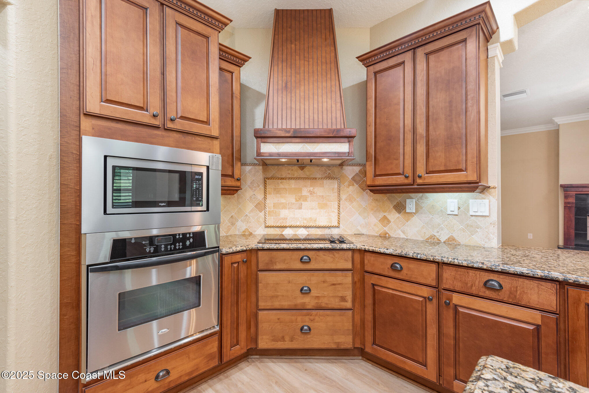 3260 Quantum Place Mims, FL 32754 - Photo 6 of 43 a kitchen with granite countertop cabinets stainless steel appliances and a window