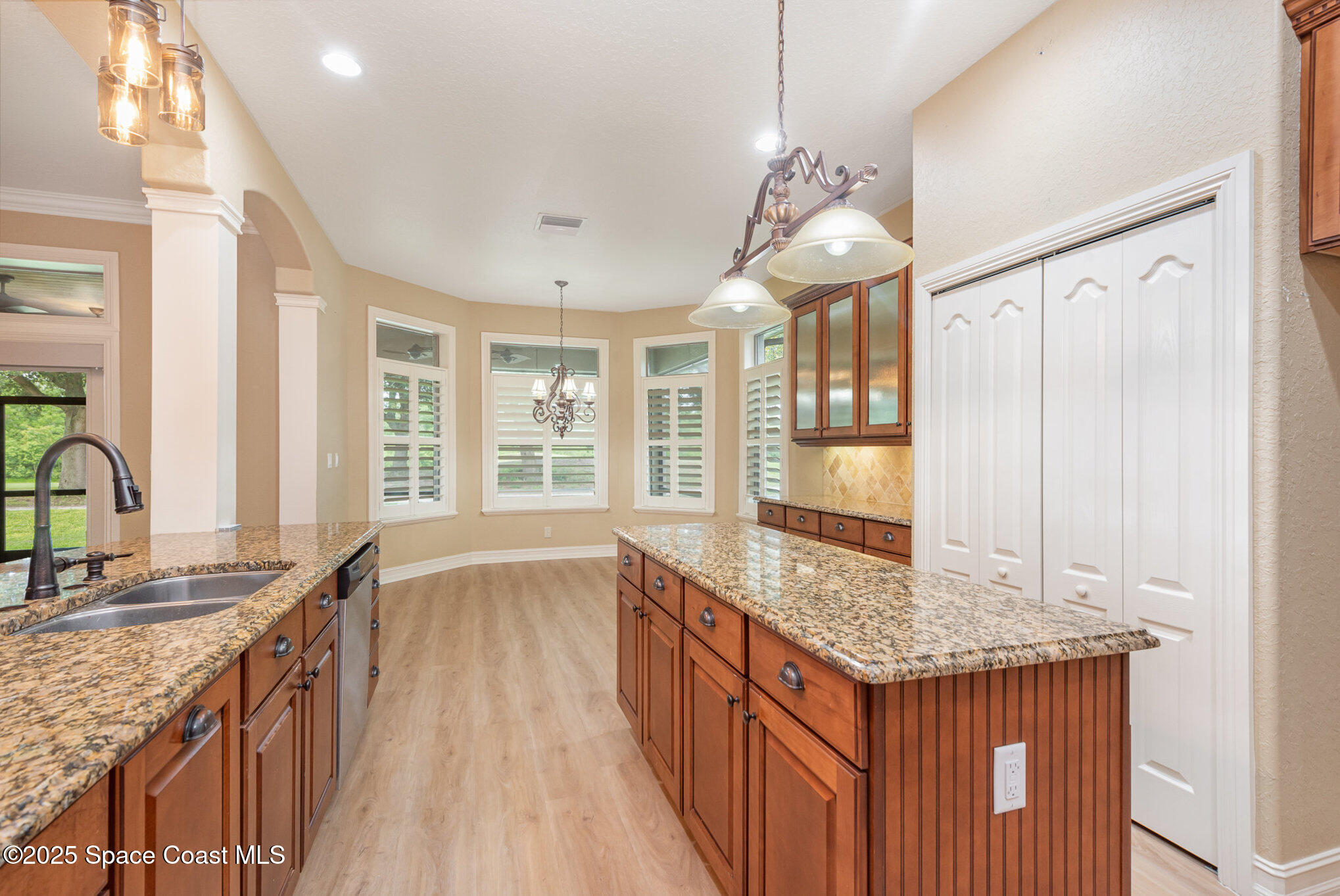 3260 Quantum Place Mims, FL 32754 - Photo 8 of 43 a spacious bathroom with a granite countertop sink and a large mirror