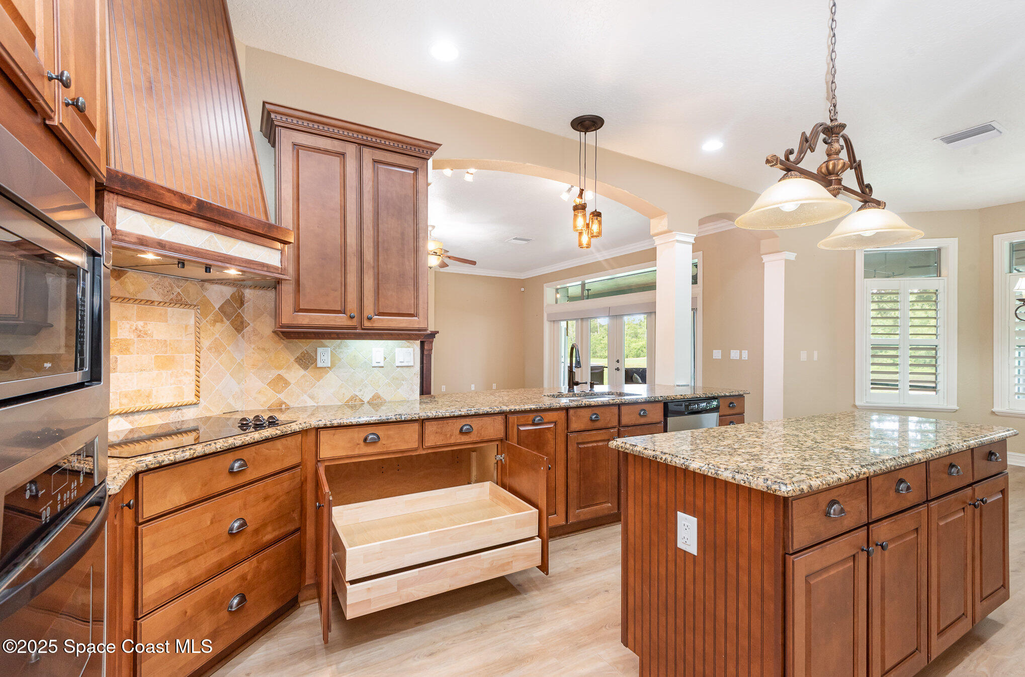 3260 Quantum Place Mims, FL 32754 - Photo 9 of 43 a kitchen with stainless steel appliances granite countertop a sink and a granite counter tops