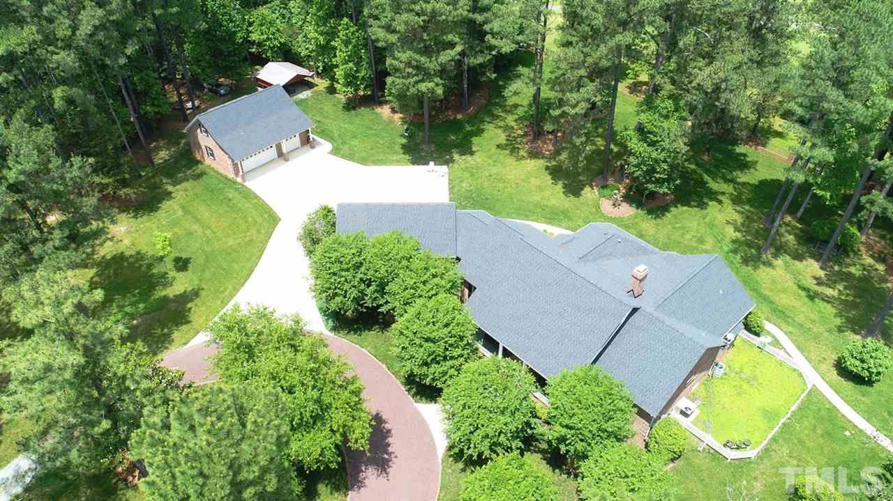 3230 Preacher Holmes Road Graham, NC 27253 - Photo 20 of 24 Mature trees border the property for quiet and beauty