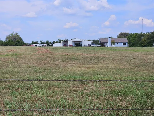 a view of a lake with houses in the background