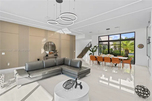 a living room with furniture and a large window