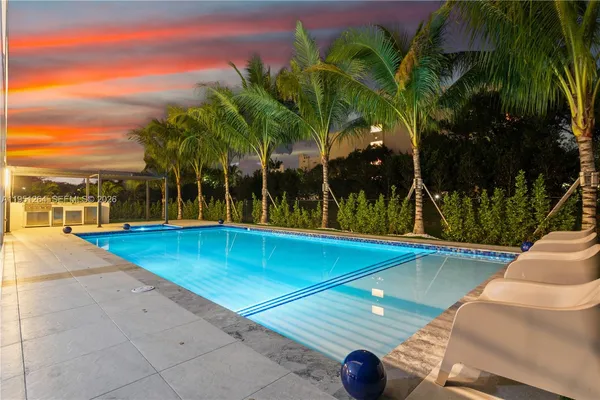 a view of house with outdoor space and swimming pool