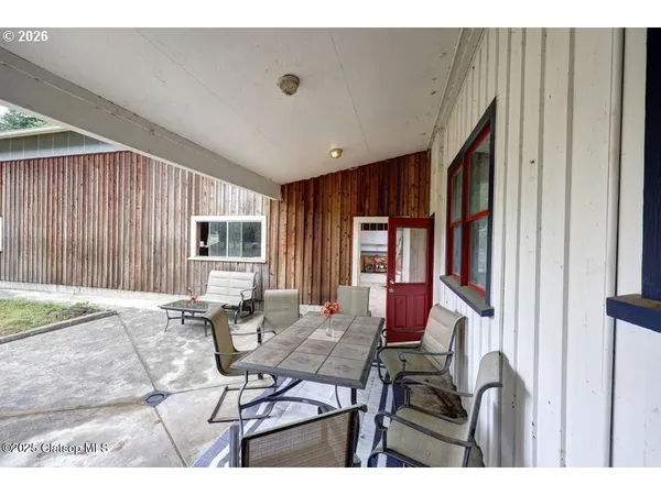 a view of a house with outdoor seating