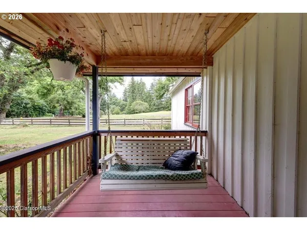 a view of a porch with wooden floor and outdoor space