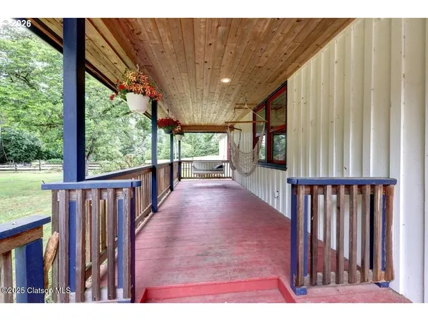 a view of a street with a big yard