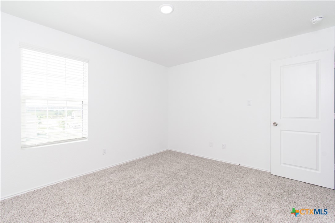 9101 Daisy Cutter Crossing Georgetown, TX 78626 - Photo 19 of 28 an empty room with a window