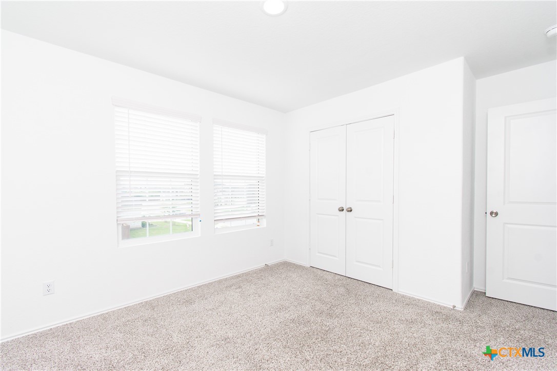 9101 Daisy Cutter Crossing Georgetown, TX 78626 - Photo 22 of 28 an empty room with windows