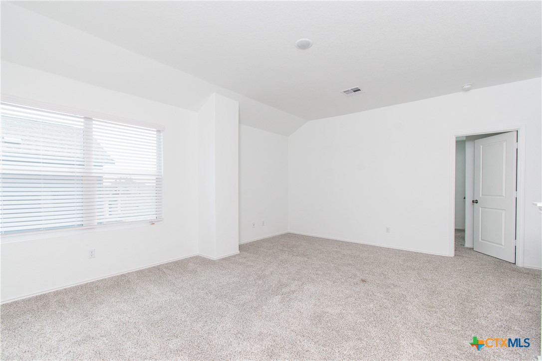 9101 Daisy Cutter Crossing Georgetown, TX 78626 - Photo 24 of 28 a view of an empty room with a window