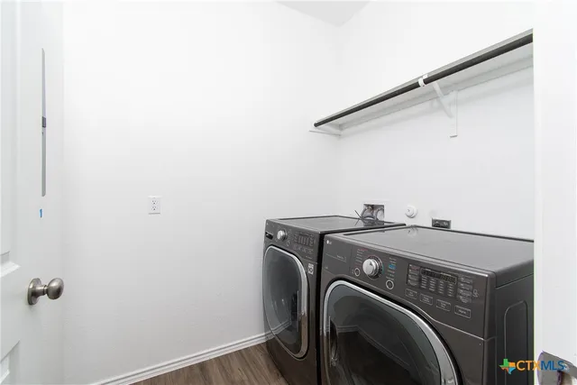 a utility room with dryer and washer