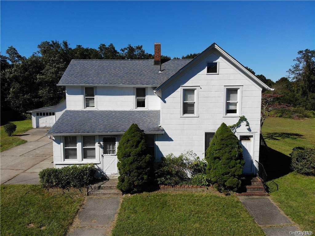 14 Fuoco Road Bellport, NY 11713 - Photo 1 of 1 a front view of a house with a yard