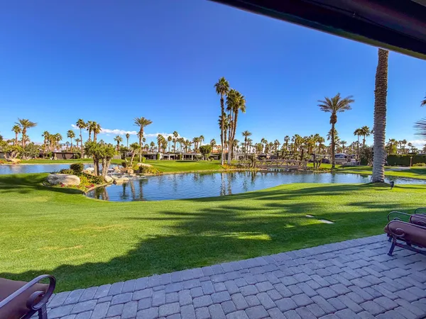 a view of a lake with a big yard