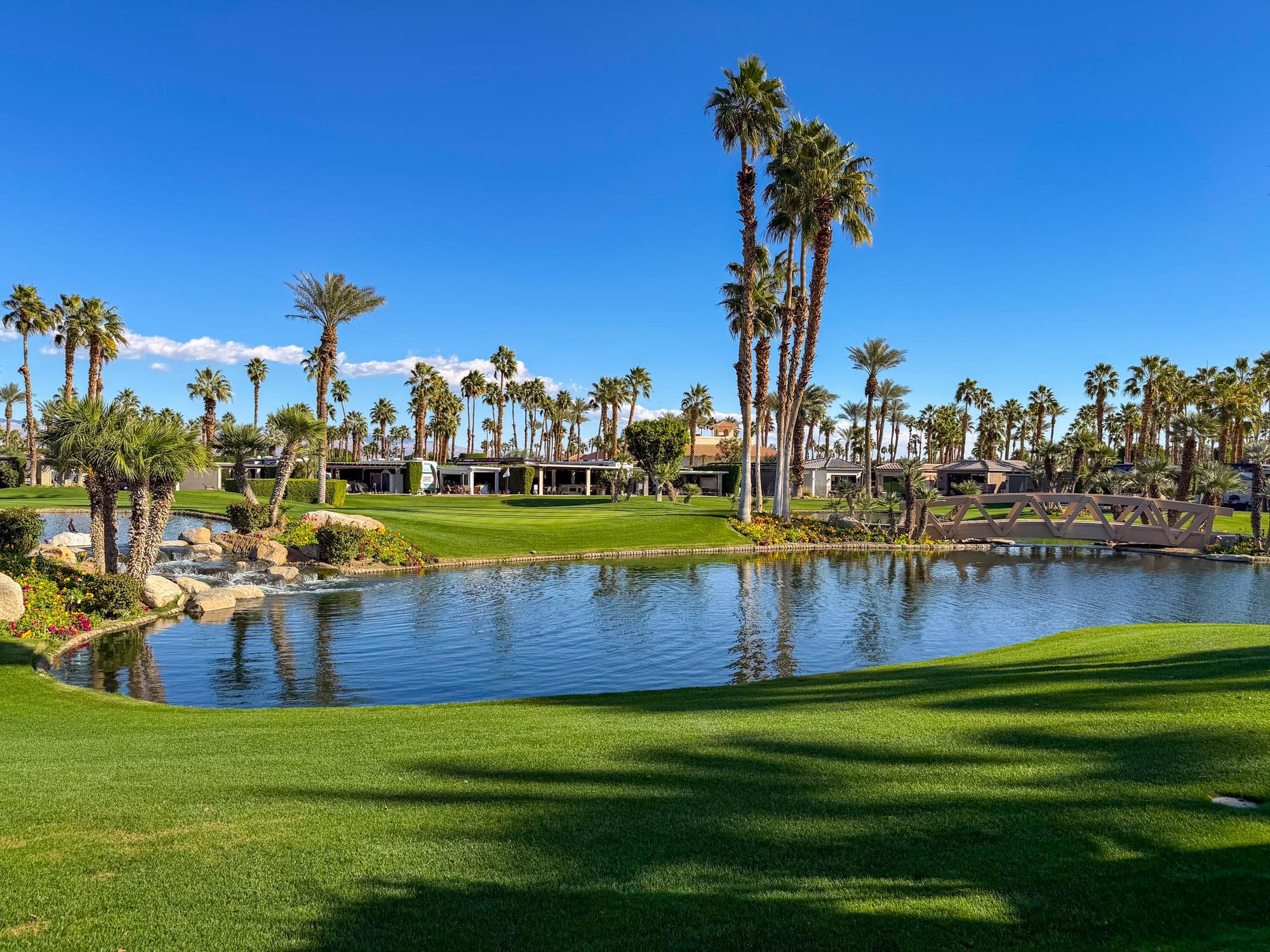 80394 Ave 48, Unit 321 Indio, CA 92201 - Photo 14 of 20 a view of a lake with houses in the background