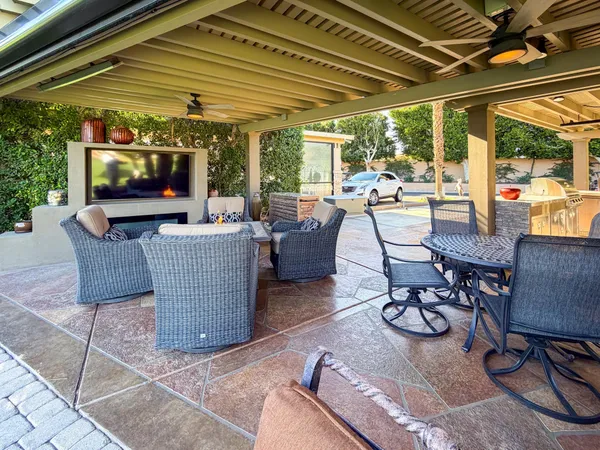 a building outdoor space with patio furniture and potted plants