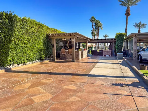 a view of a house with basketball court