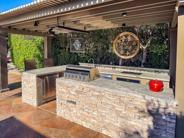 a view of a room with a wooden floor and a fireplace