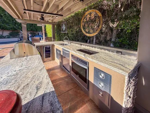 a kitchen with a stove and a sink