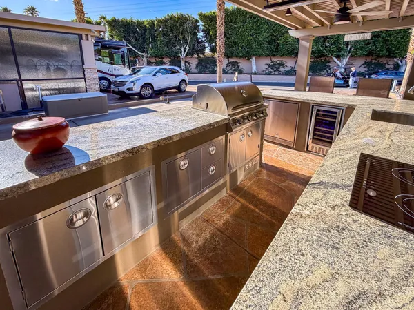a view of outdoor kitchen with sitting area