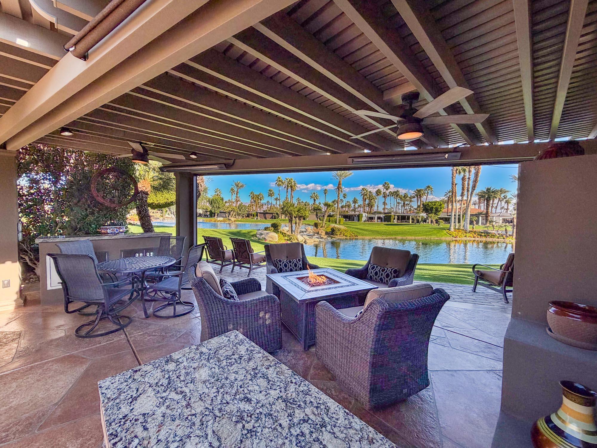 80394 Ave 48, Unit 321 Indio, CA 92201 - Photo 9 of 20 a view of a patio with a table chairs and a backyard