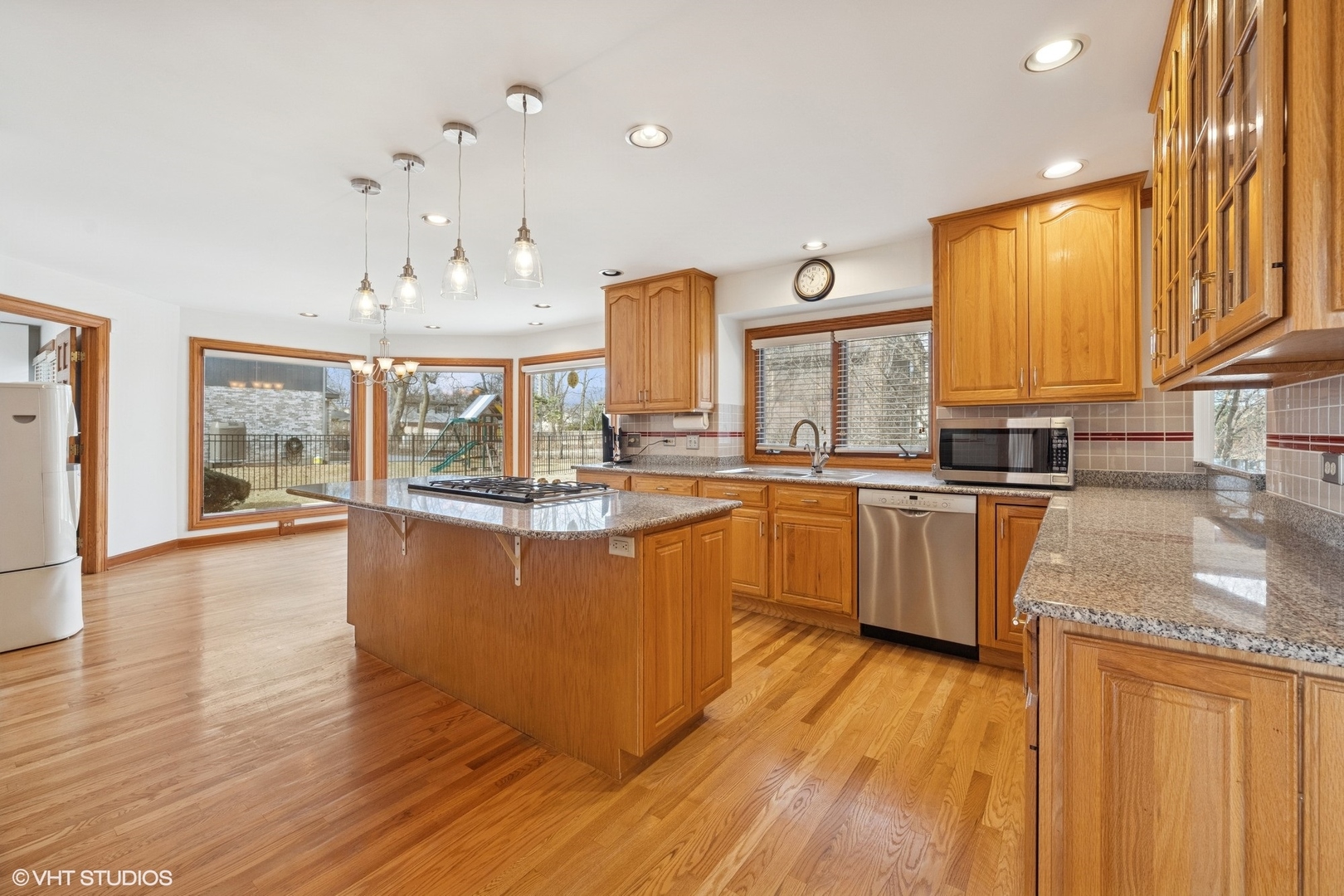 3170 Keystone Road Northbrook, IL 60062 - Photo 11 of 42 a kitchen with stainless steel appliances granite countertop wooden floors and sink