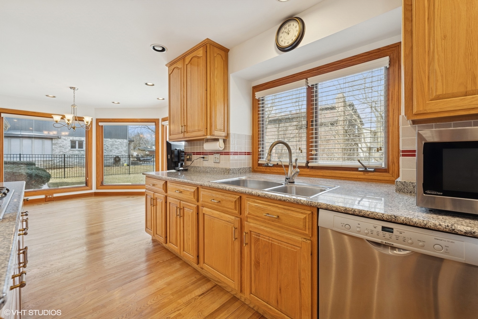 3170 Keystone Road Northbrook, IL 60062 - Photo 12 of 42 a kitchen with stainless steel appliances granite countertop a sink a stove and a wooden cabinets