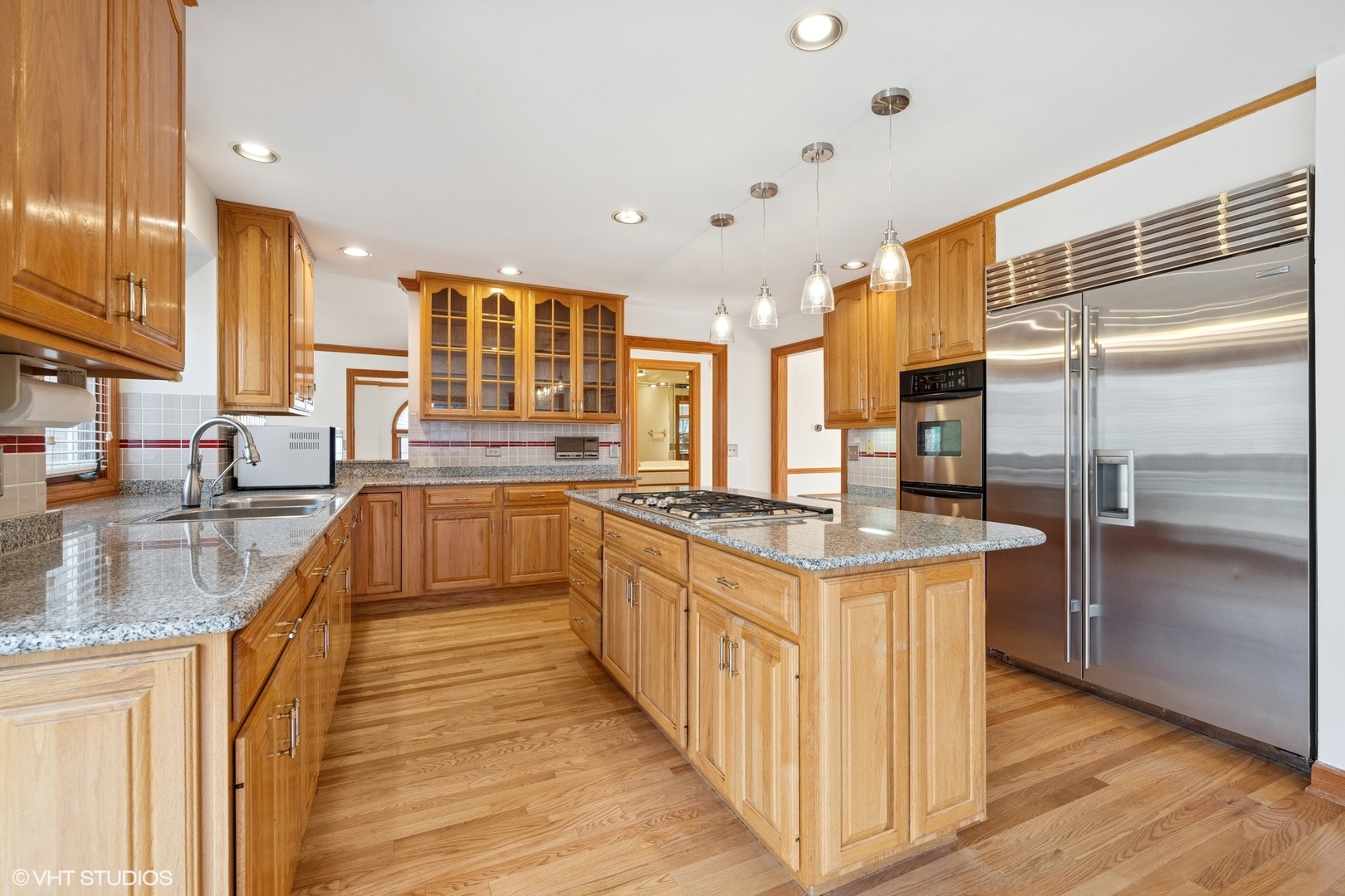 3170 Keystone Road Northbrook, IL 60062 - Photo 14 of 42 a kitchen with stainless steel appliances granite countertop a sink a stove and a refrigerator