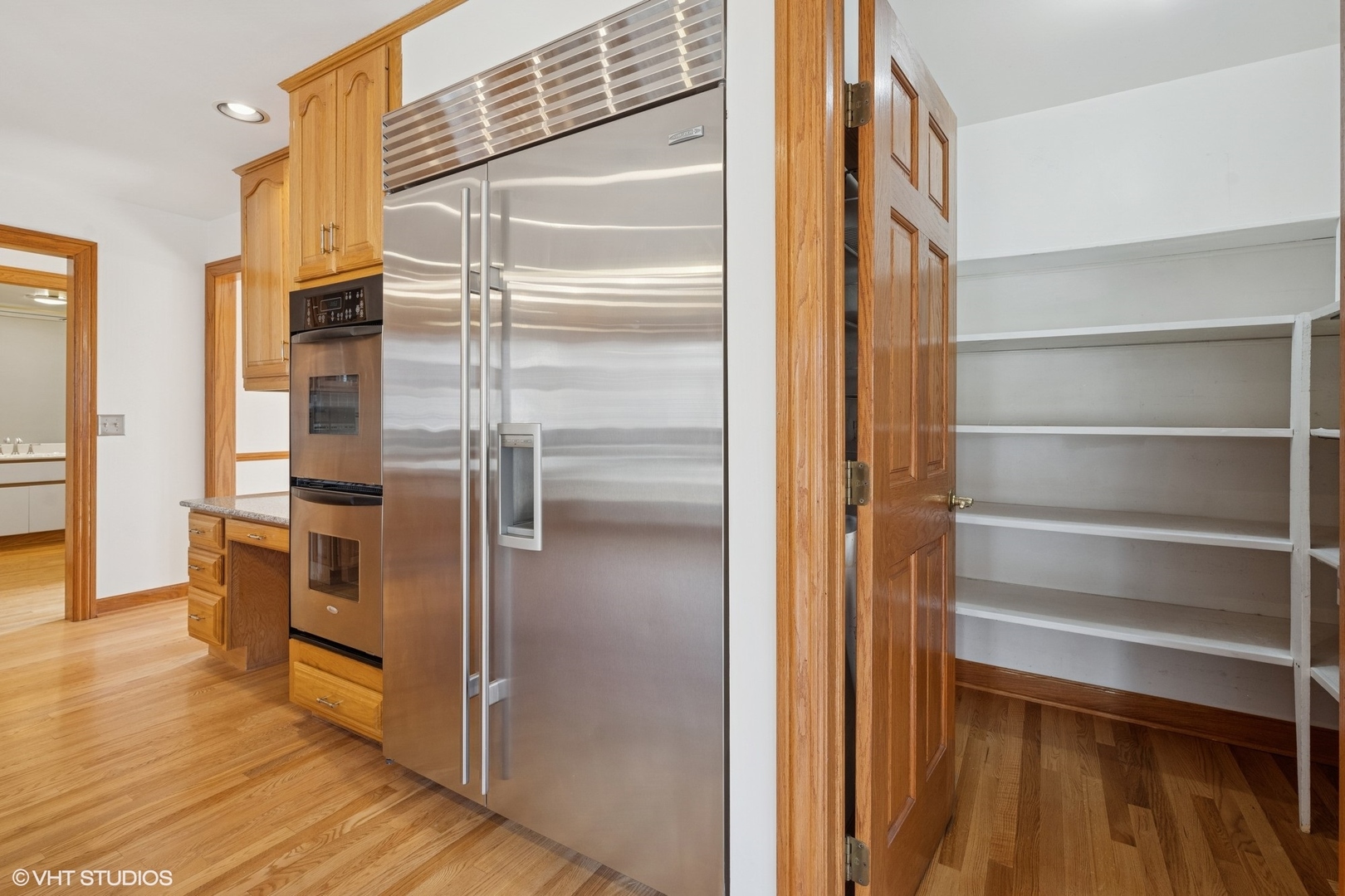 3170 Keystone Road Northbrook, IL 60062 - Photo 15 of 42 a kitchen with a refrigerator and wooden floor