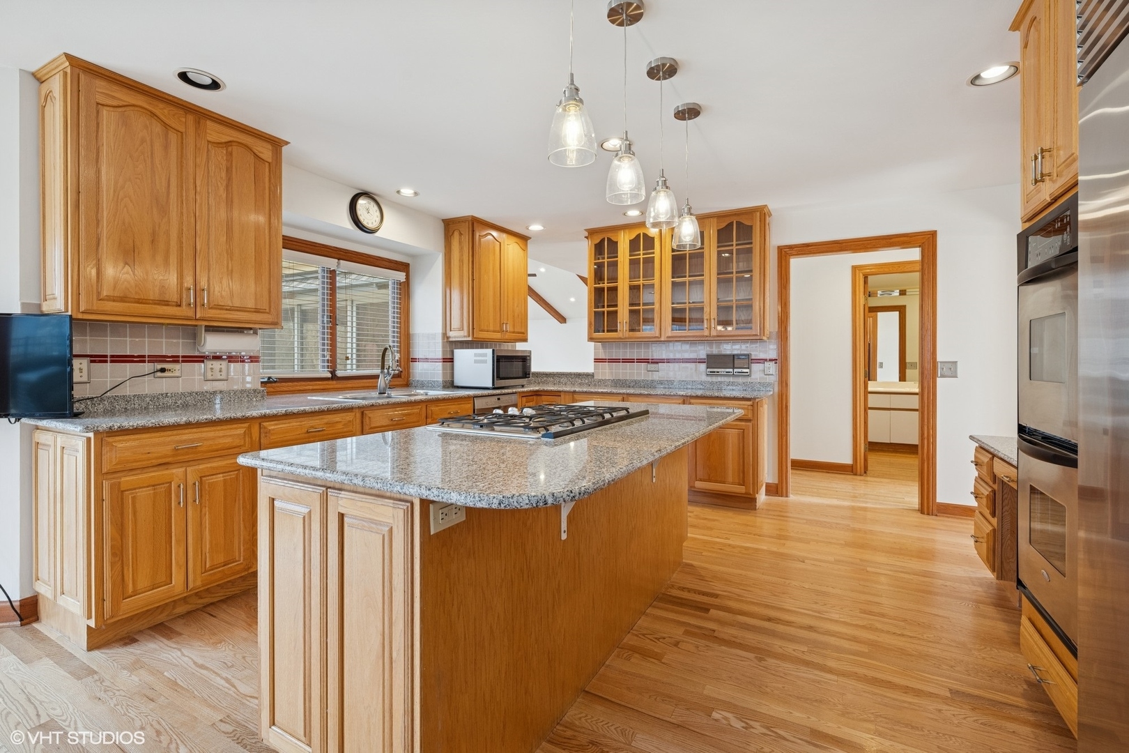 3170 Keystone Road Northbrook, IL 60062 - Photo 16 of 42 a large kitchen with stainless steel appliances granite countertop a sink stove and refrigerator