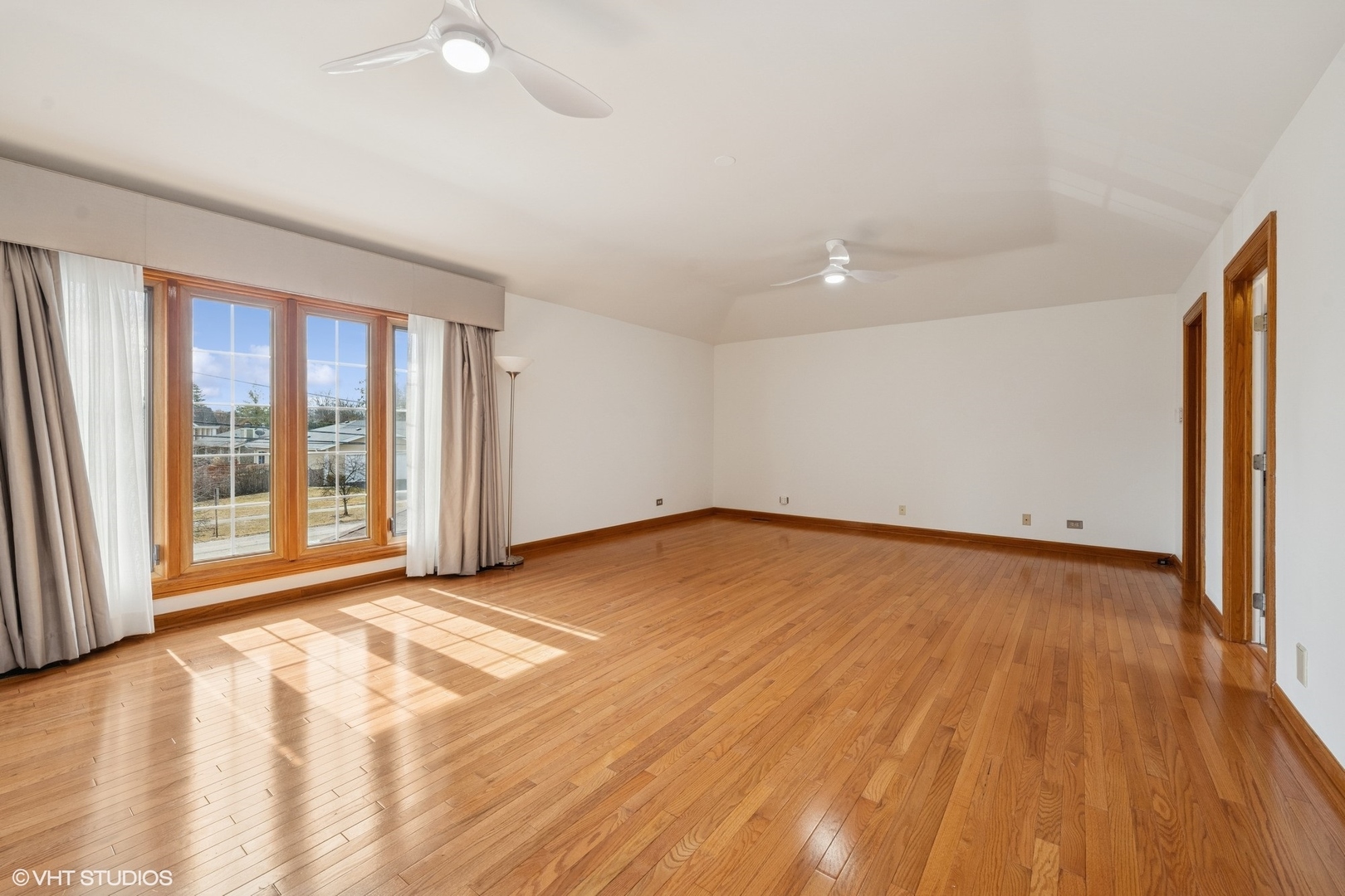 3170 Keystone Road Northbrook, IL 60062 - Photo 20 of 42 a view of an empty room with wooden floor and a window