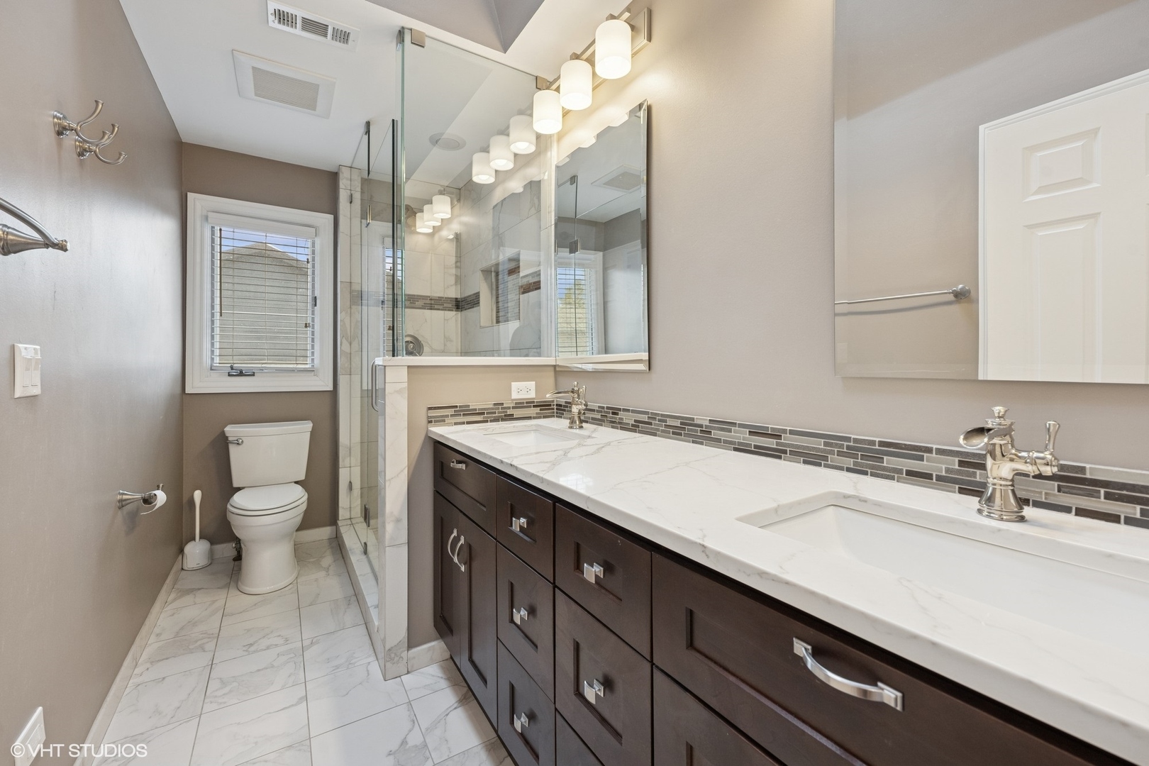 3170 Keystone Road Northbrook, IL 60062 - Photo 26 of 42 a spacious bathroom with a granite countertop sink a toilet and a mirror