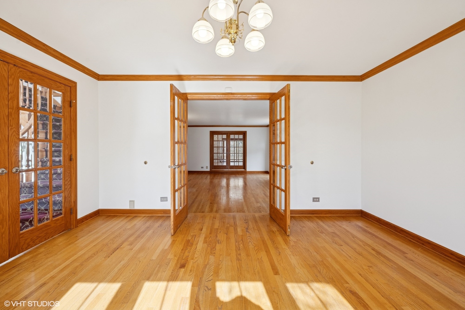 3170 Keystone Road Northbrook, IL 60062 - Photo 3 of 42 a view of an empty room with wooden floor and a window