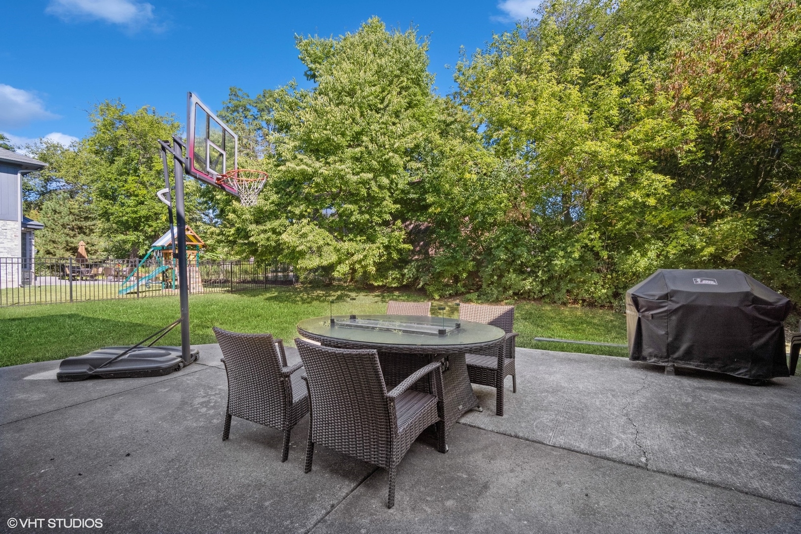 3170 Keystone Road Northbrook, IL 60062 - Photo 36 of 42 a view of a patio with table and chairs potted plants and a large tree