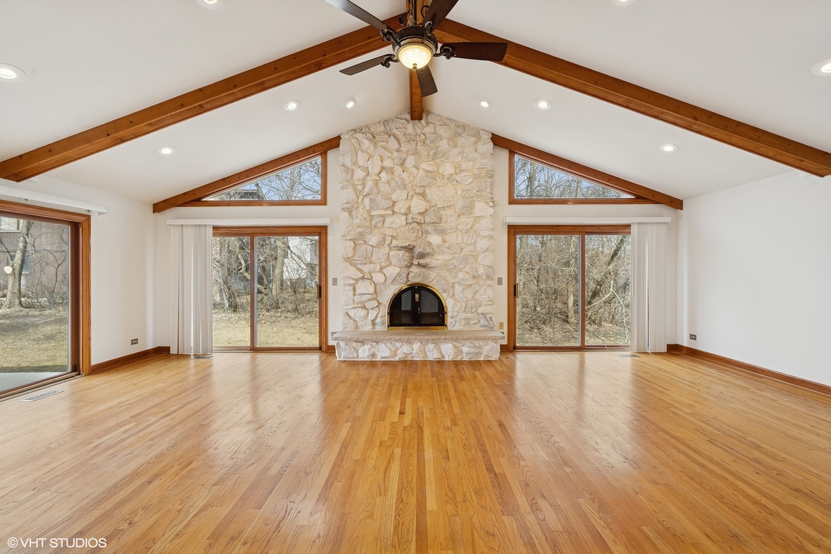 3170 Keystone Road Northbrook, IL 60062 - Photo 7 of 42 a view of empty room with wooden floor and fireplace