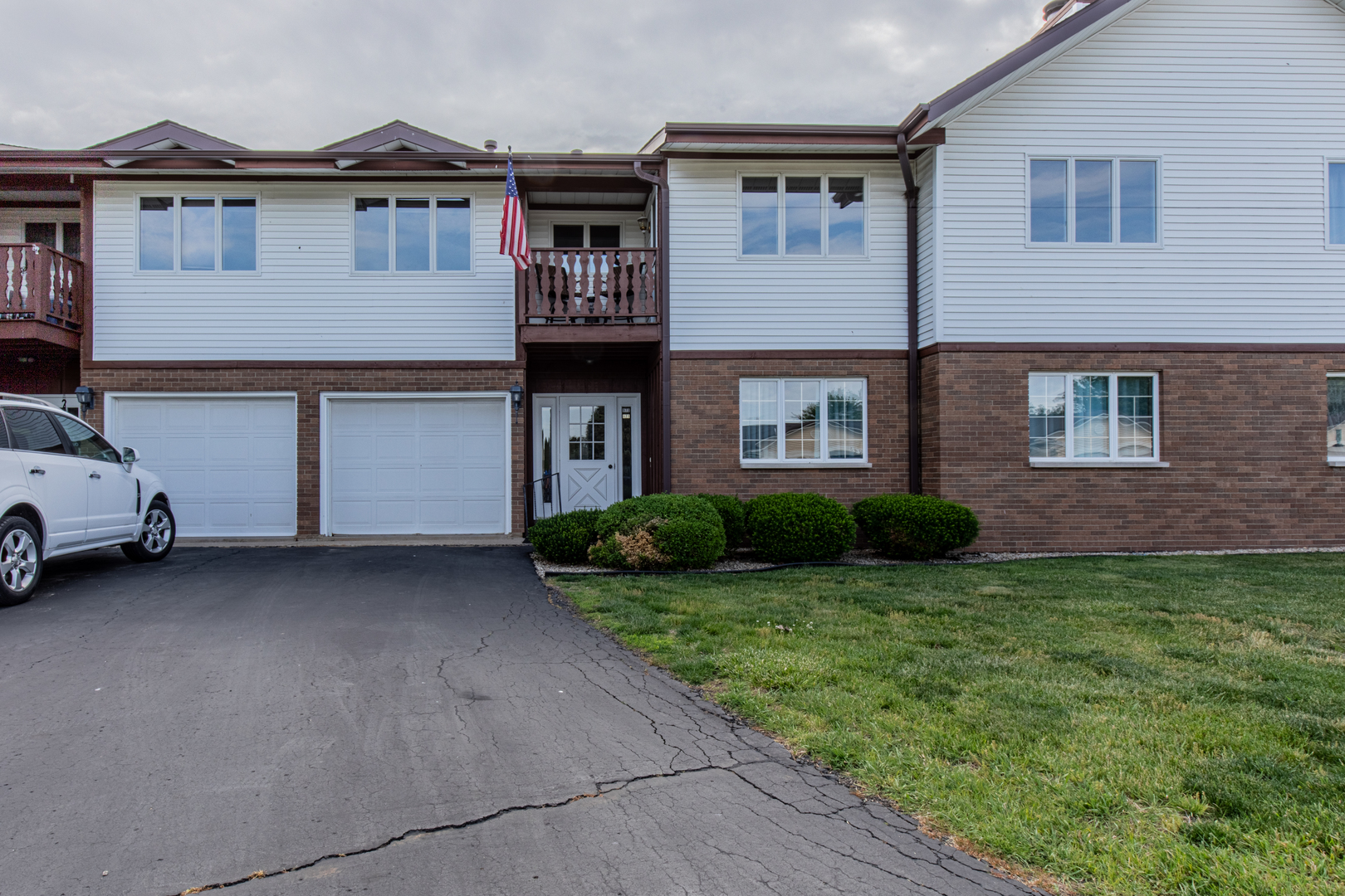 973 Innsbruck Lane, Unit 4G Princeton, IL 61356 - Photo 1 of 15 a view of a house with a garden and yard