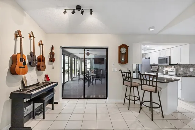 a view of a livingroom with furniture and workspace