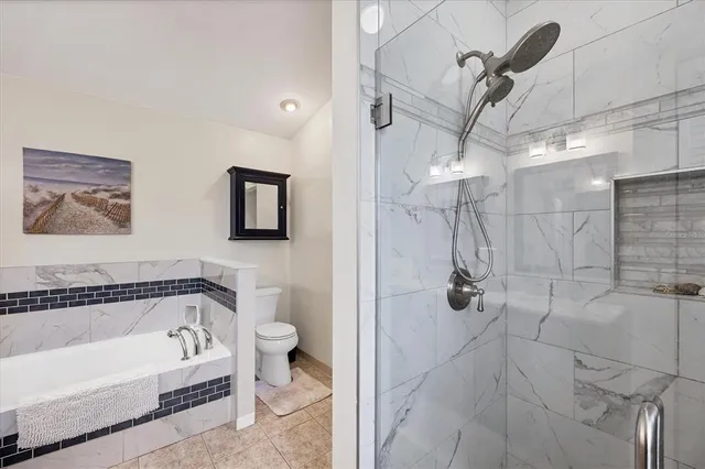 a bathroom with a bathtub and shower