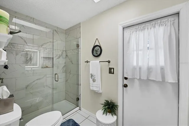 a bathroom with a toilet sink and shower