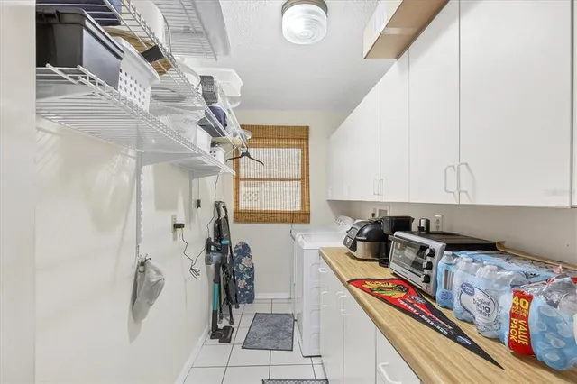 a kitchen with stainless steel appliances granite countertop a refrigerator and a stove