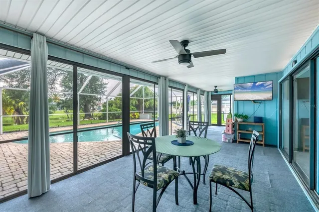 a dining room with furniture window and outside view