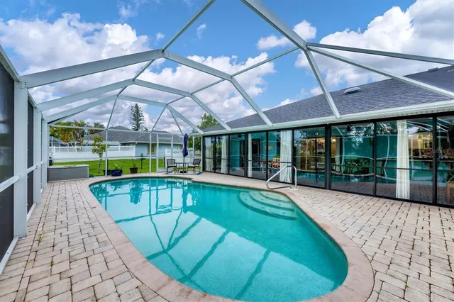 a view of a swimming pool with a patio