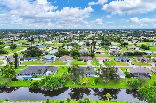a view of a swimming pool with a yard